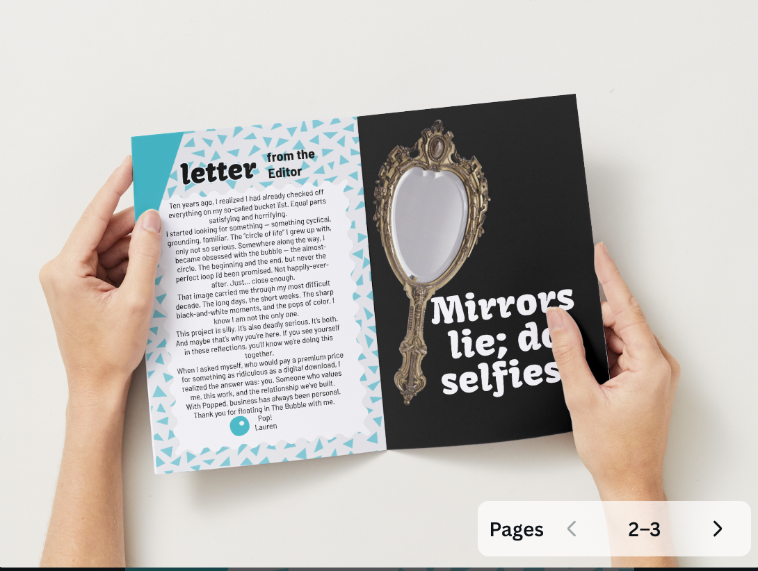 Hands holding the Aqua Bubble ritual zine showing seasonal reflection and visual design